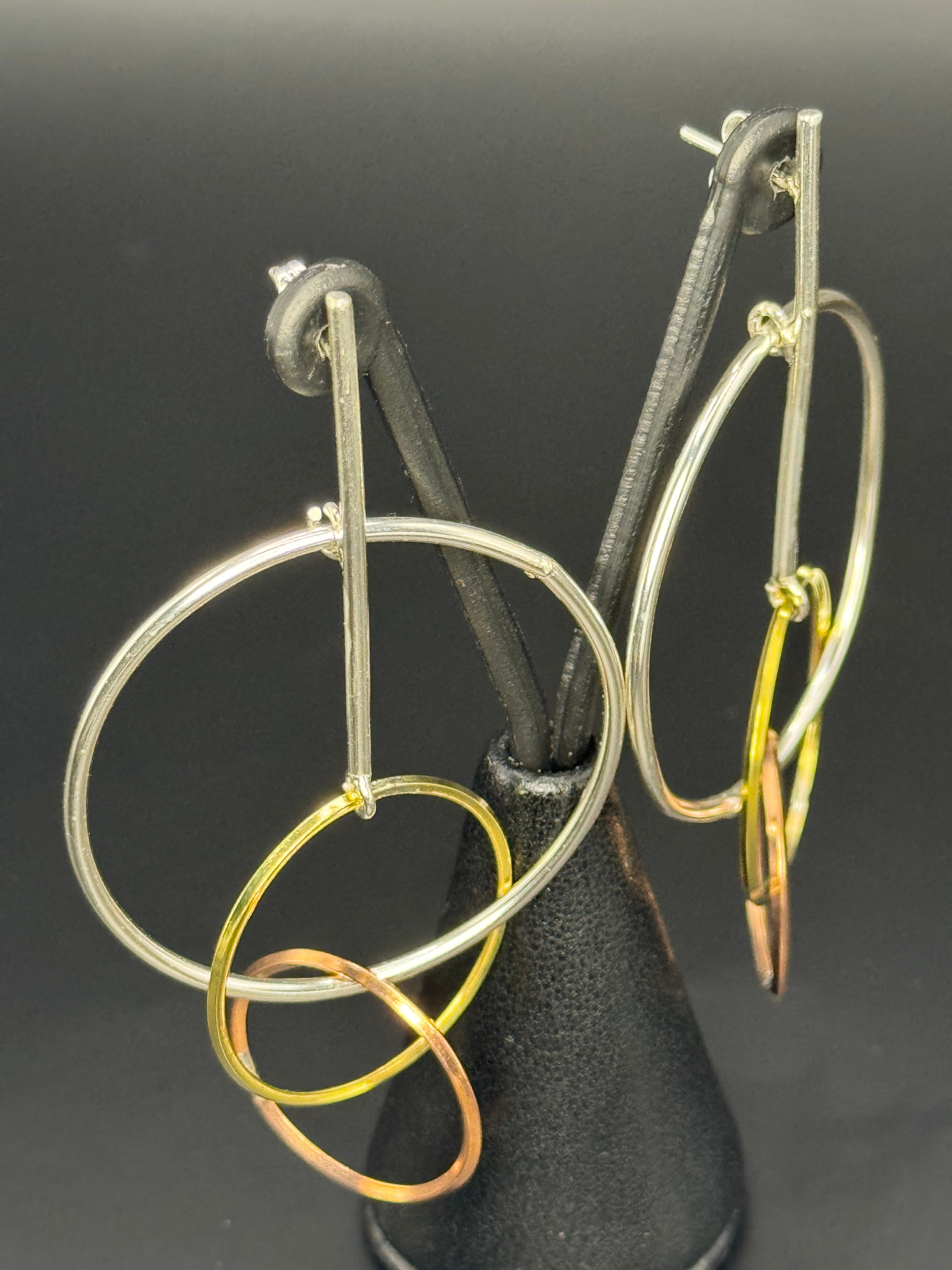 Sterling Silver Dangling Hoopes earrings.