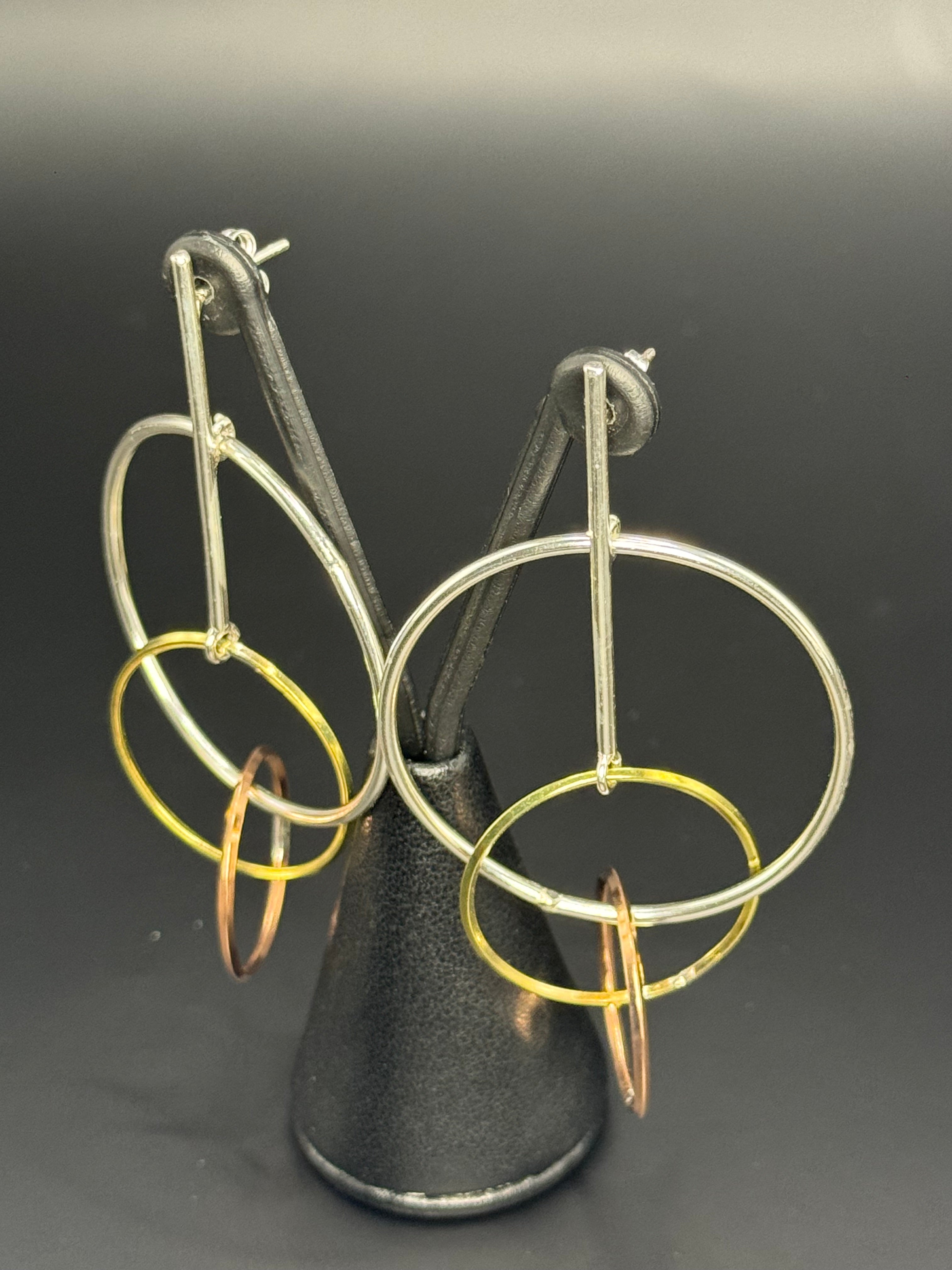 Sterling Silver Dangling Hoopes earrings.