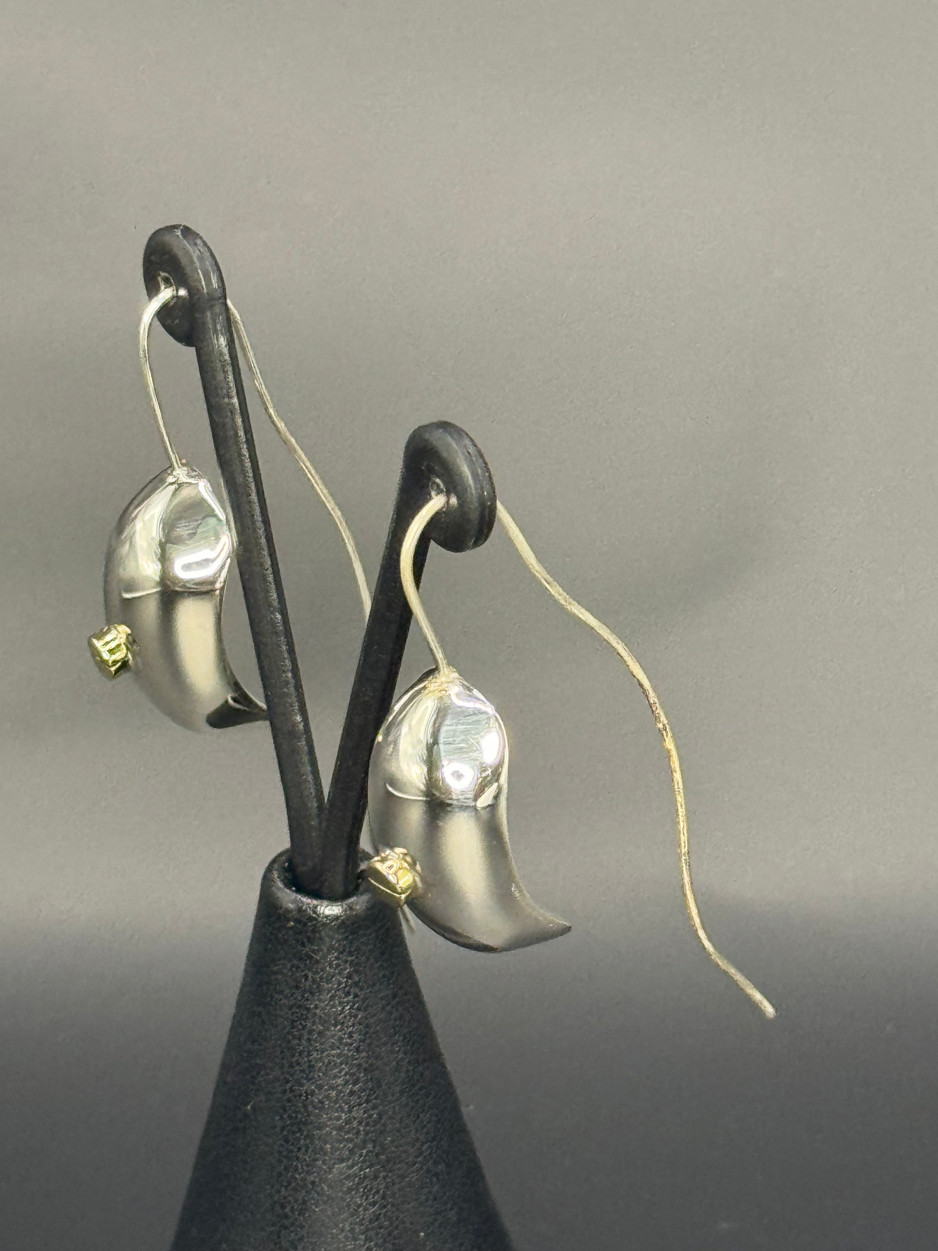 Sterling Silver Unique Fashioned Earrings .