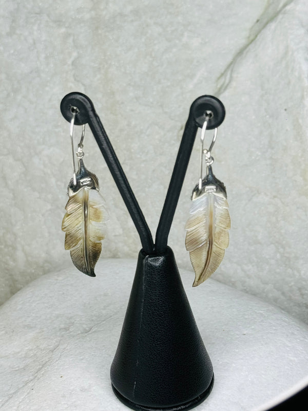 Earrings with feather