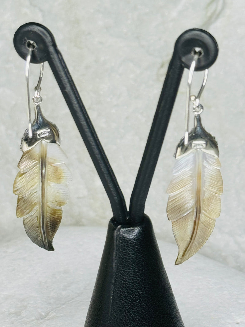 Earrings with feather