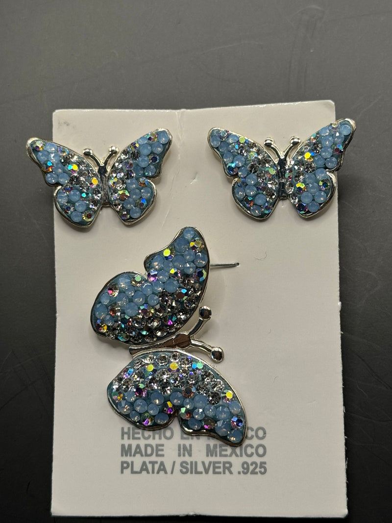 Butterfly Pendant & Earrings in light blue crystals. Medium size .