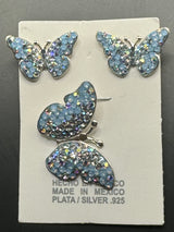 Butterfly Pendant & Earrings in light blue crystals. Medium size .